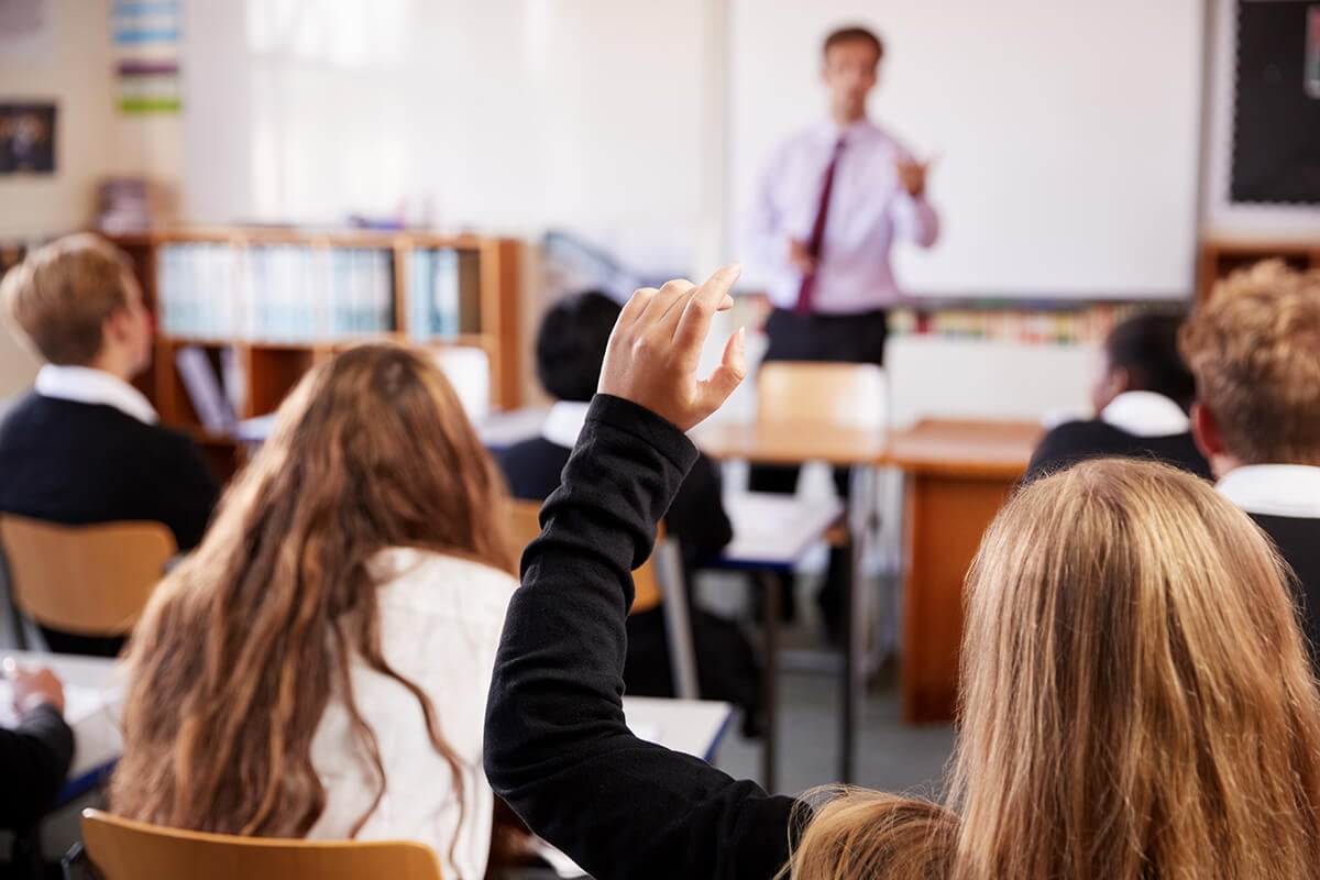 Female,Student,Raising,Hand,To,Ask,Question,In,Classroom